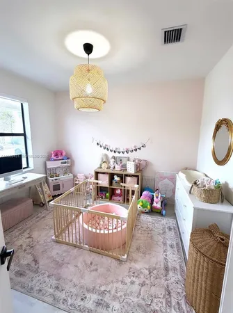 a bedroom with bed and a couch