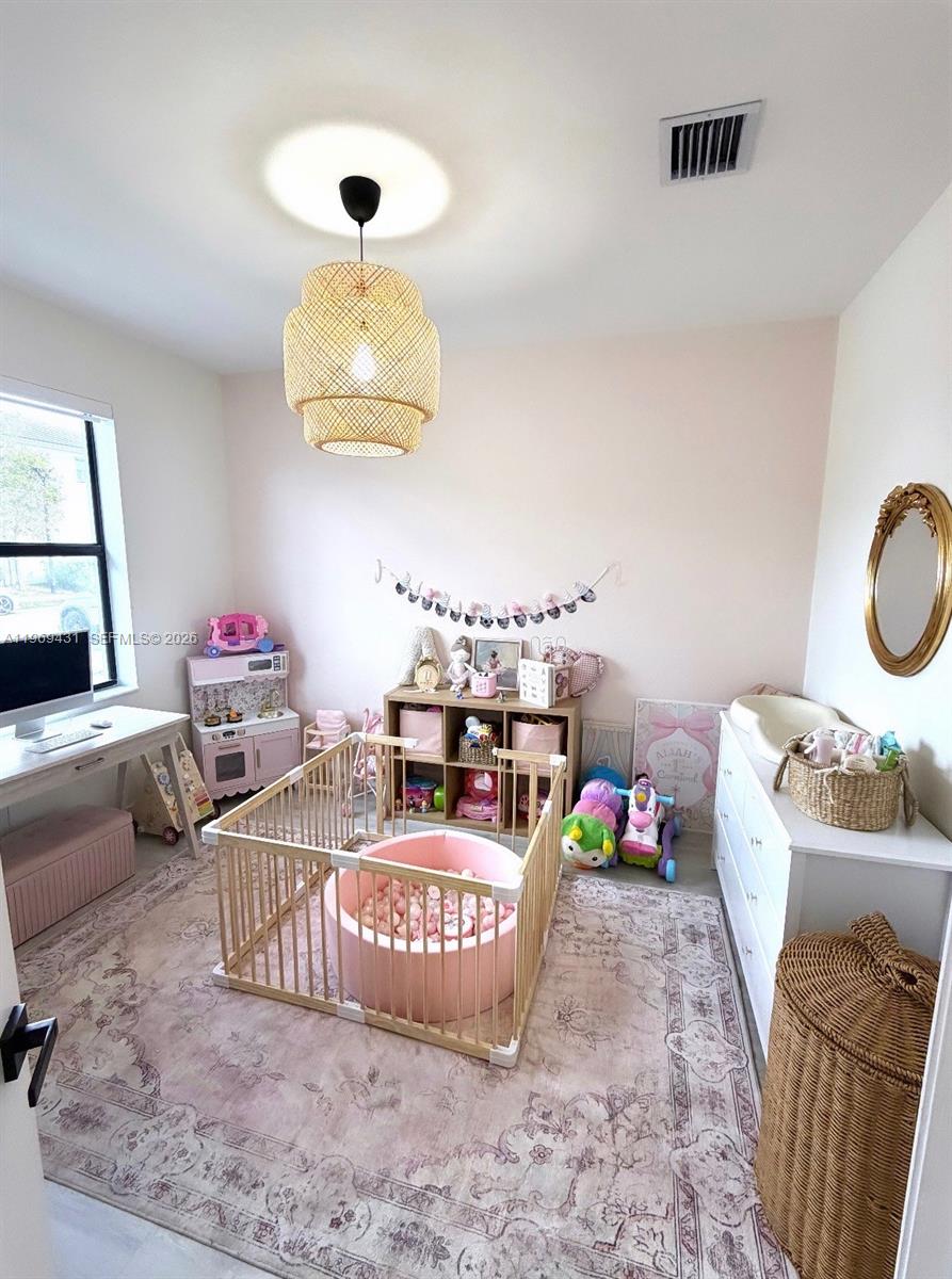 14724 Southwest 181st Terrace Miami, FL 33187 - Photo 33 of 36 a bedroom with bed and a couch