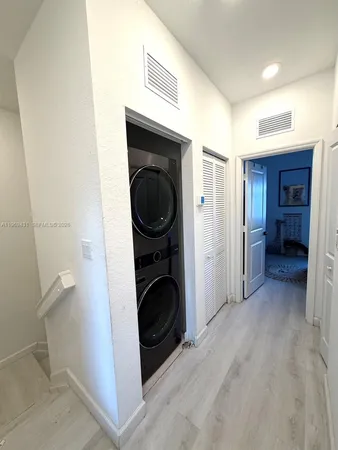 a view of a kitchen and utility room