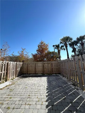 a view of a backyard of the house