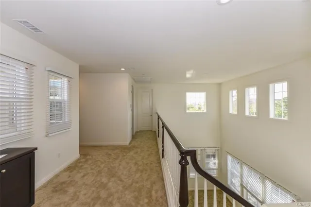 a view of an entryway with wooden floor and stairs