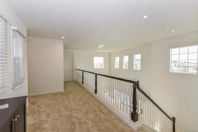 en view interior of a house with wooden floor and windows