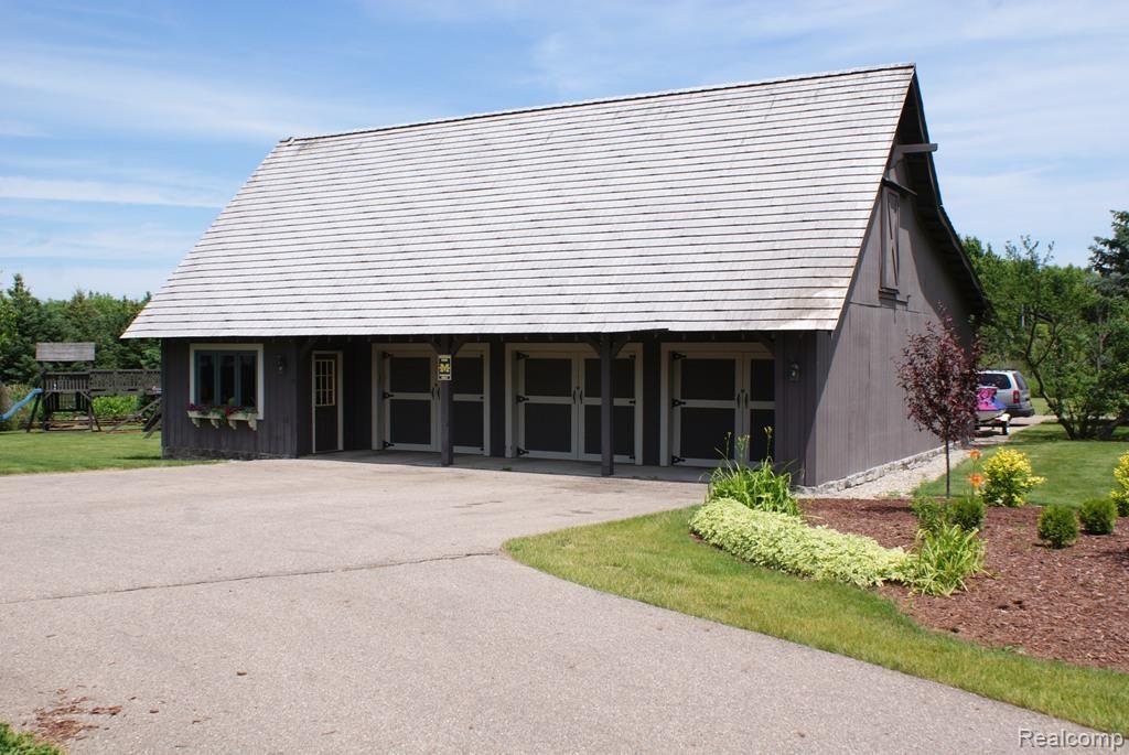 3850 West Oregon Road Lapeer, MI 48446 - Photo 8 of 94 Super sized detached garage and storage building has lots of space for grounds equipment. Also has second level attic for more usable space.