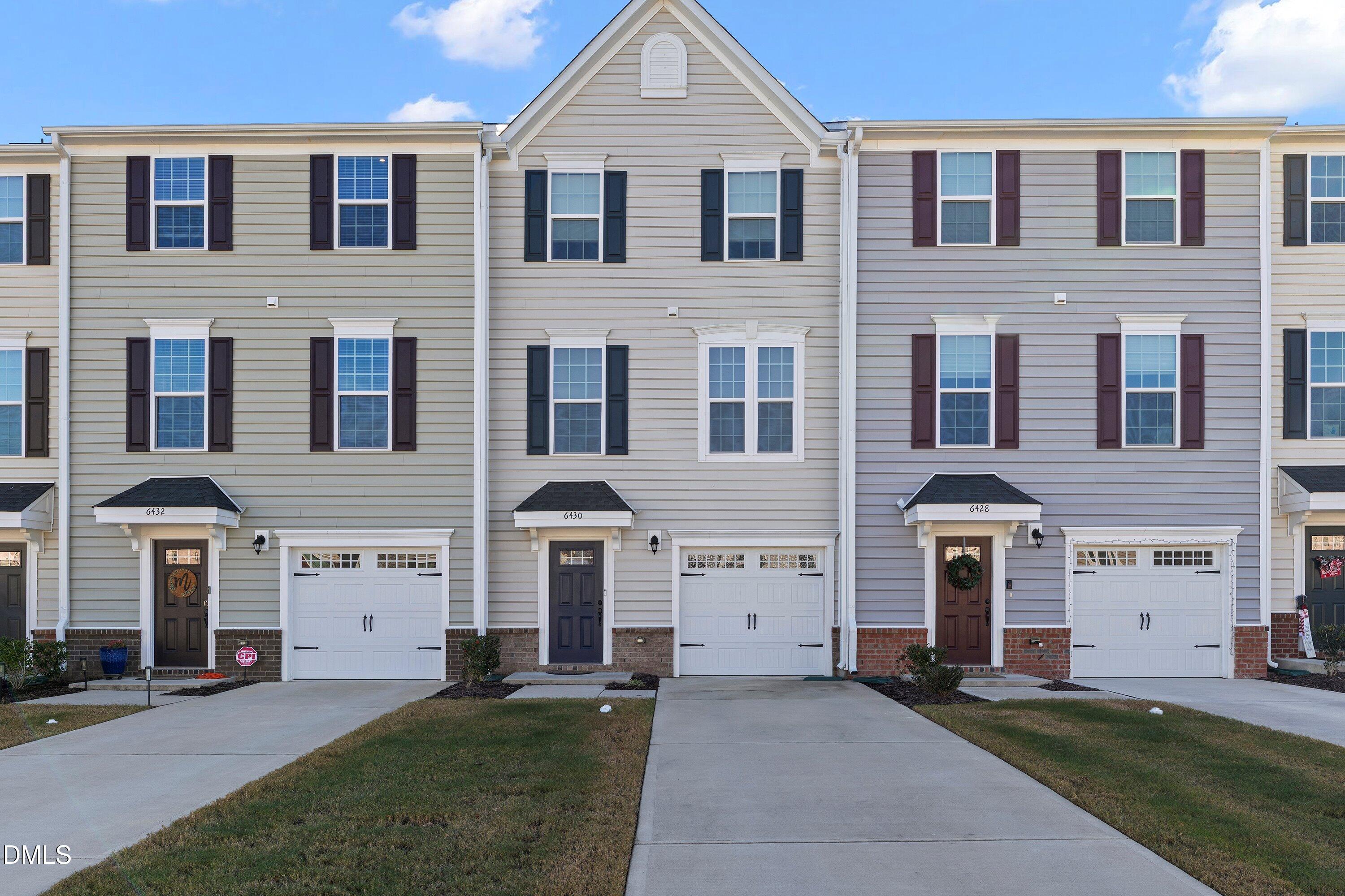 6430 Pathfinder Way Raleigh, NC 27616 - Photo 1 of 39 a front view of a house with a yard