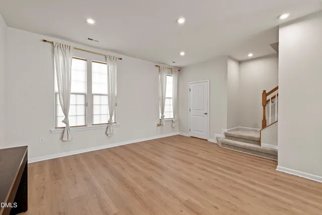 a view of kitchen with furniture and wooden floor