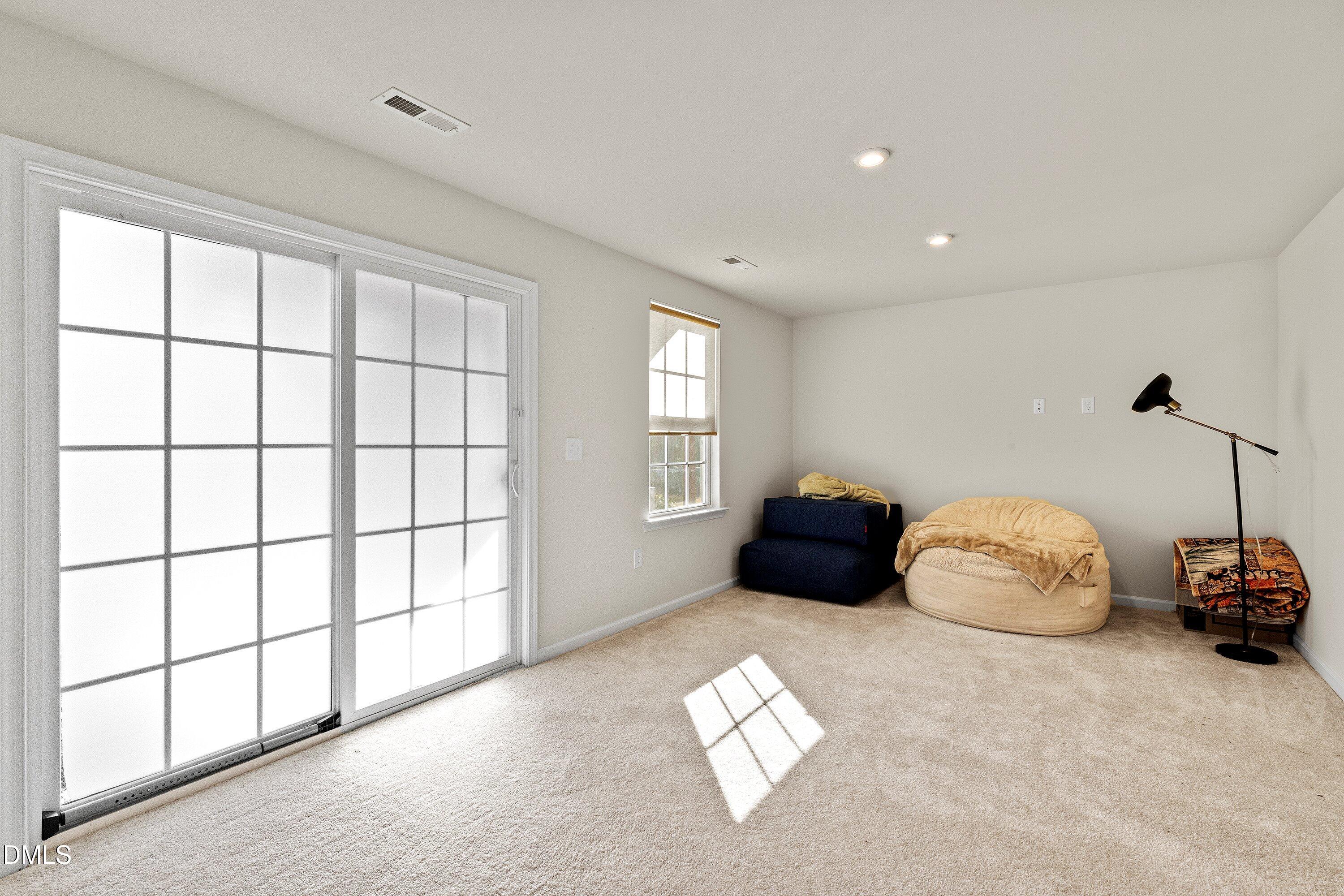 6430 Pathfinder Way Raleigh, NC 27616 - Photo 17 of 39 a bedroom with bed and window