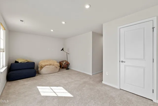 a bedroom with bed and window