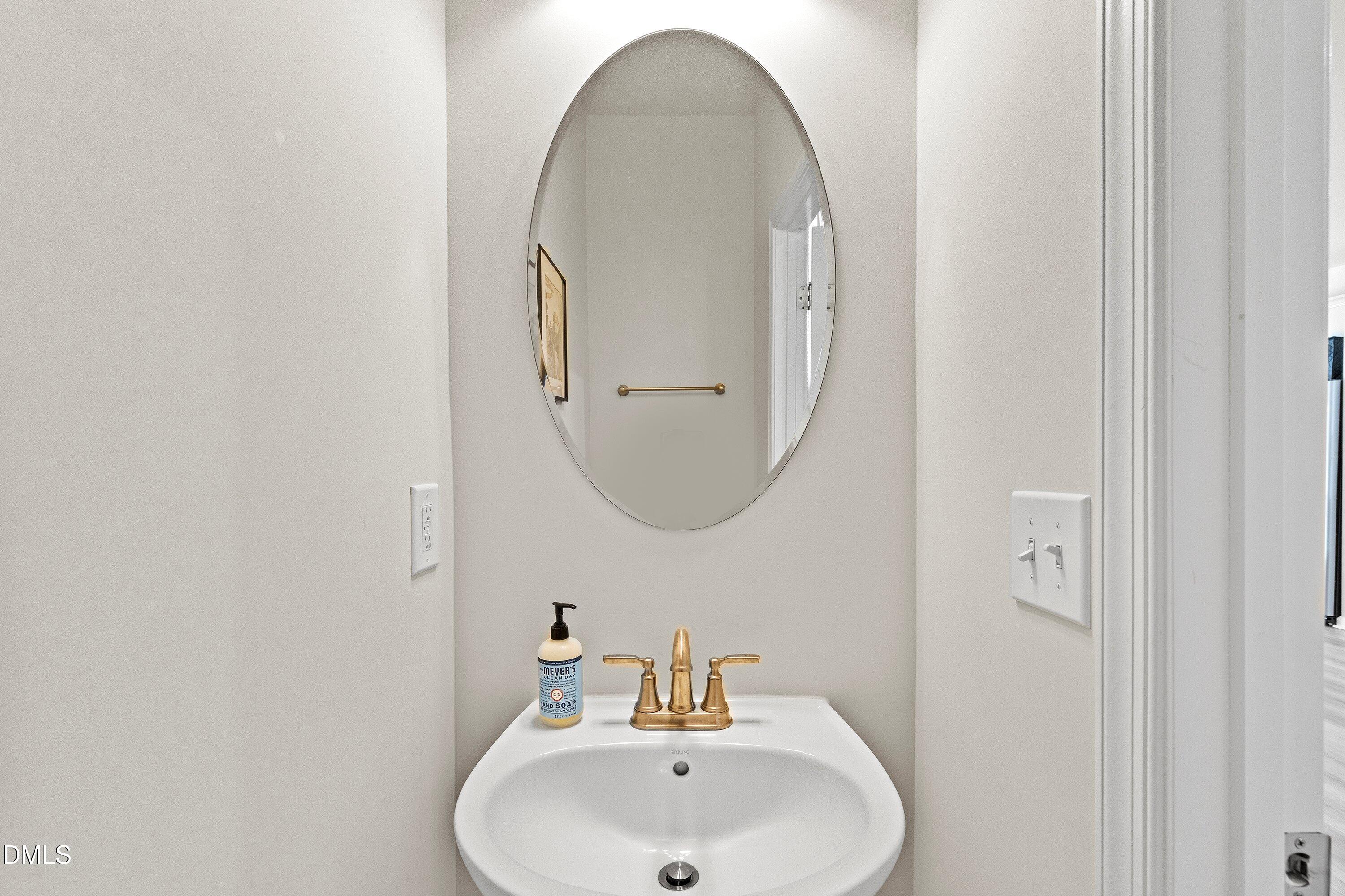 6430 Pathfinder Way Raleigh, NC 27616 - Photo 21 of 39 a bathroom with a sink and a mirror