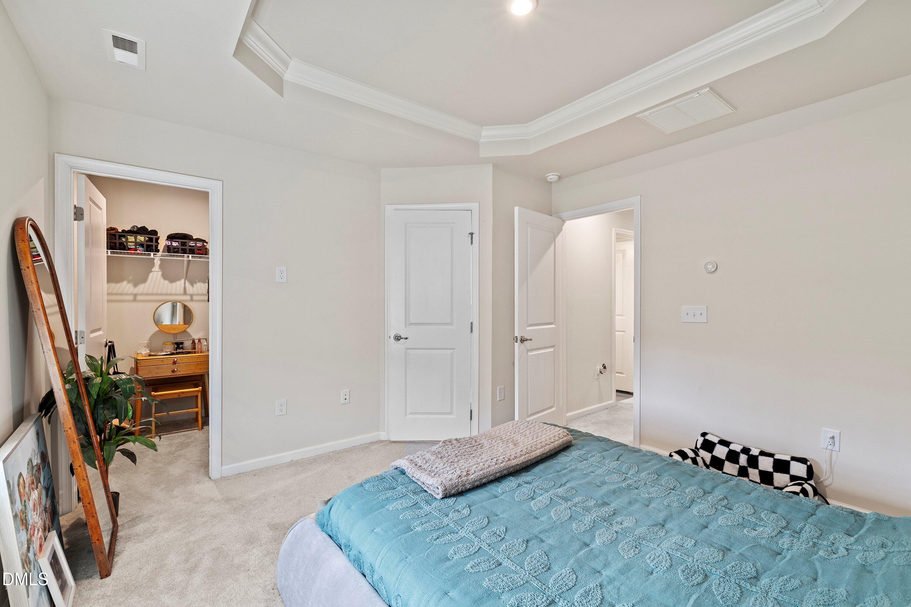 6430 Pathfinder Way Raleigh, NC 27616 - Photo 24 of 39 a bedroom with a bed and furniture
