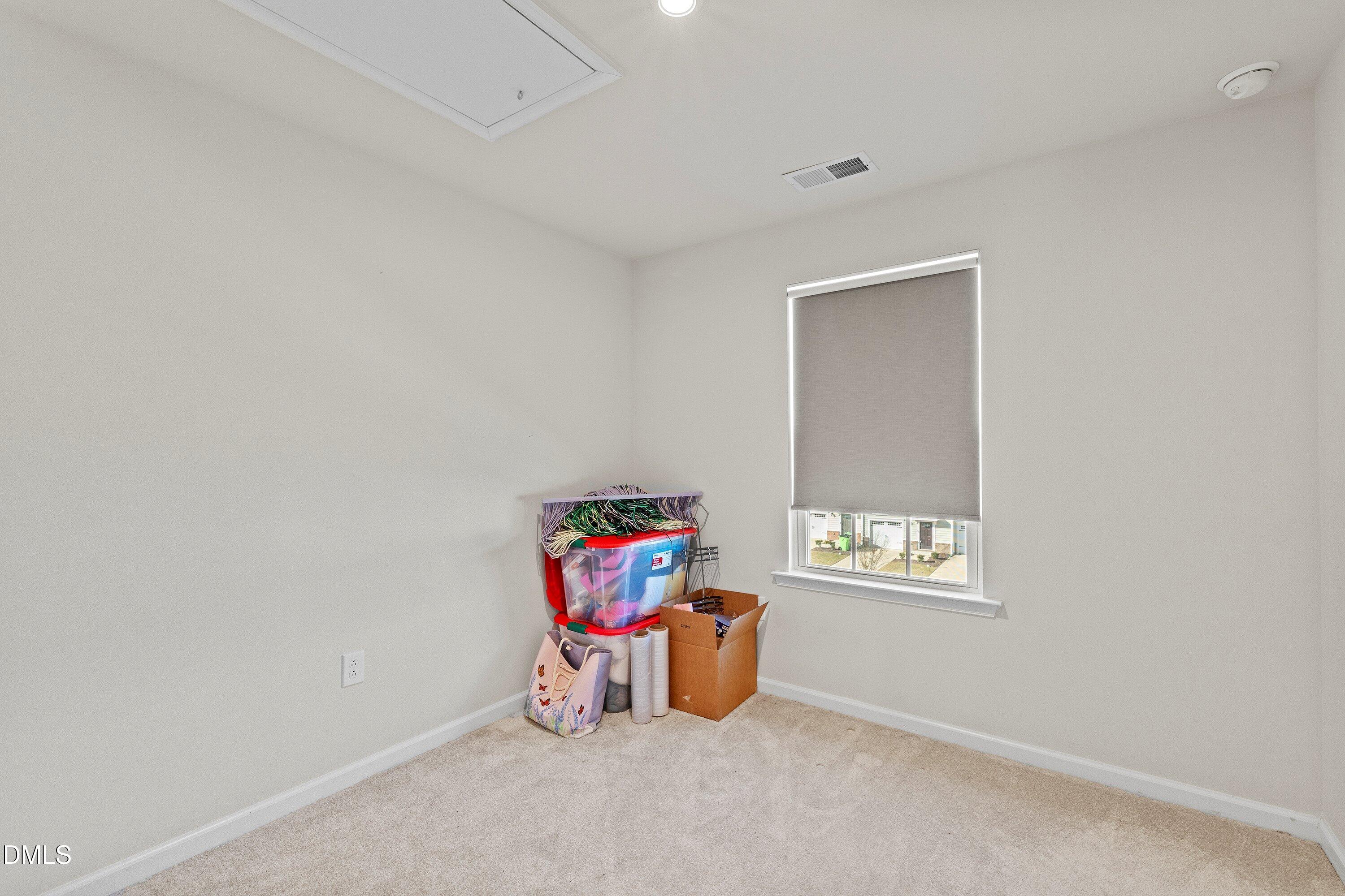 6430 Pathfinder Way Raleigh, NC 27616 - Photo 28 of 39 a room with a window and a table