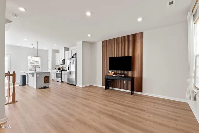 a view of entryway with wooden floor and stairs