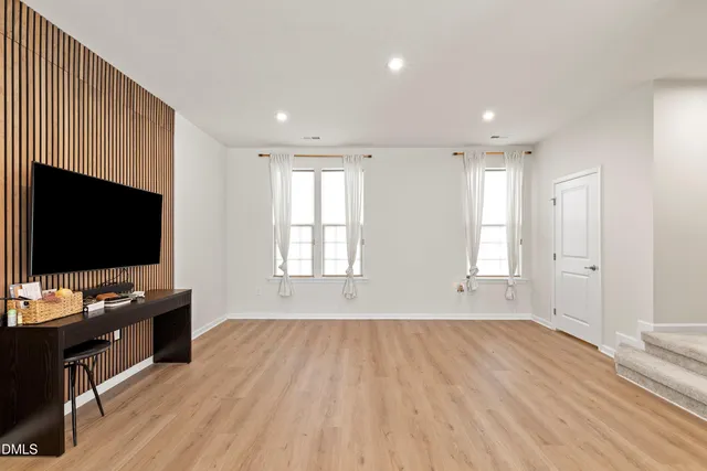 a view of a livingroom with a kitchen