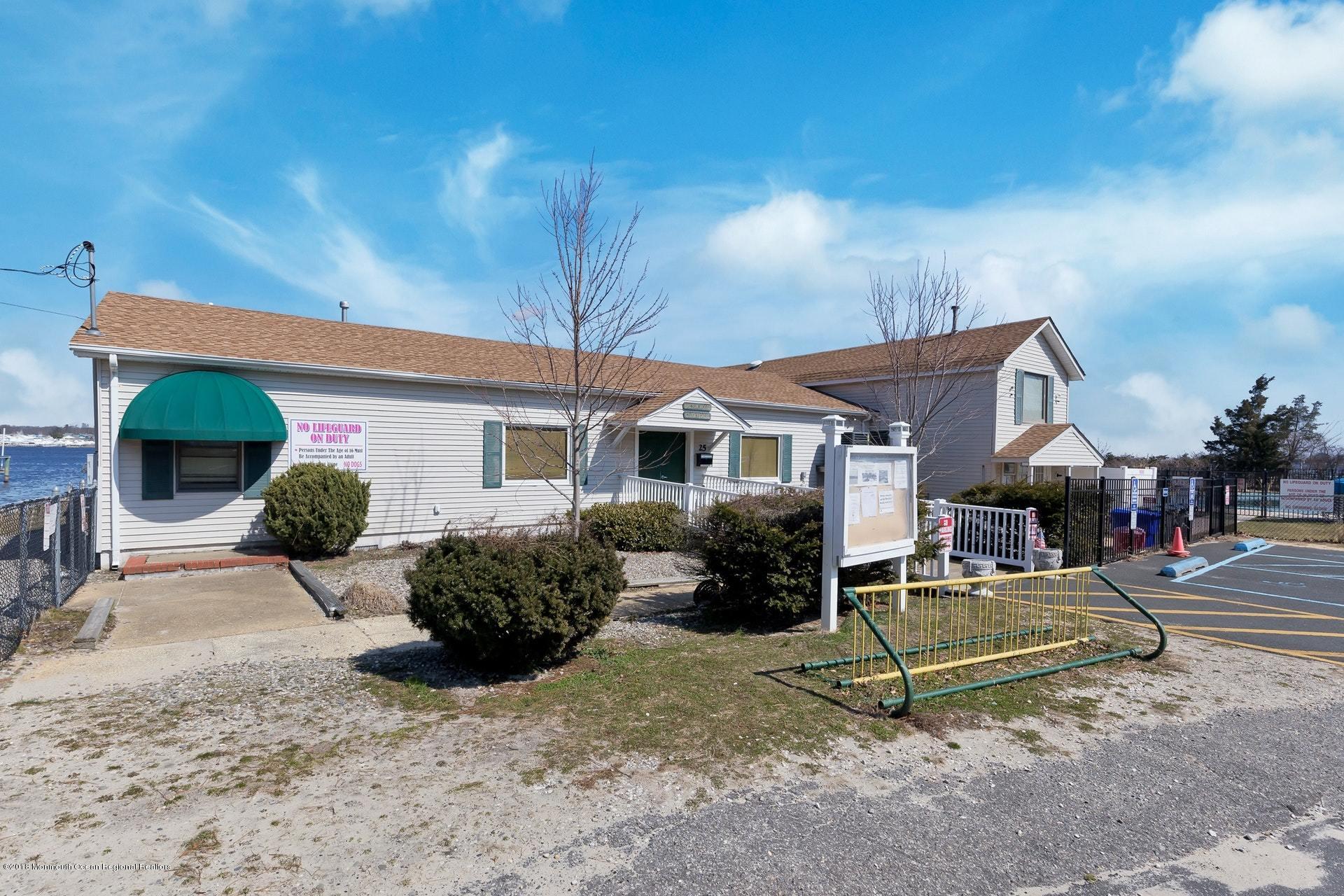 113 Pinehurst Road Brick, NJ 08723 - Photo 22 of 27 a front view of a house with a yard