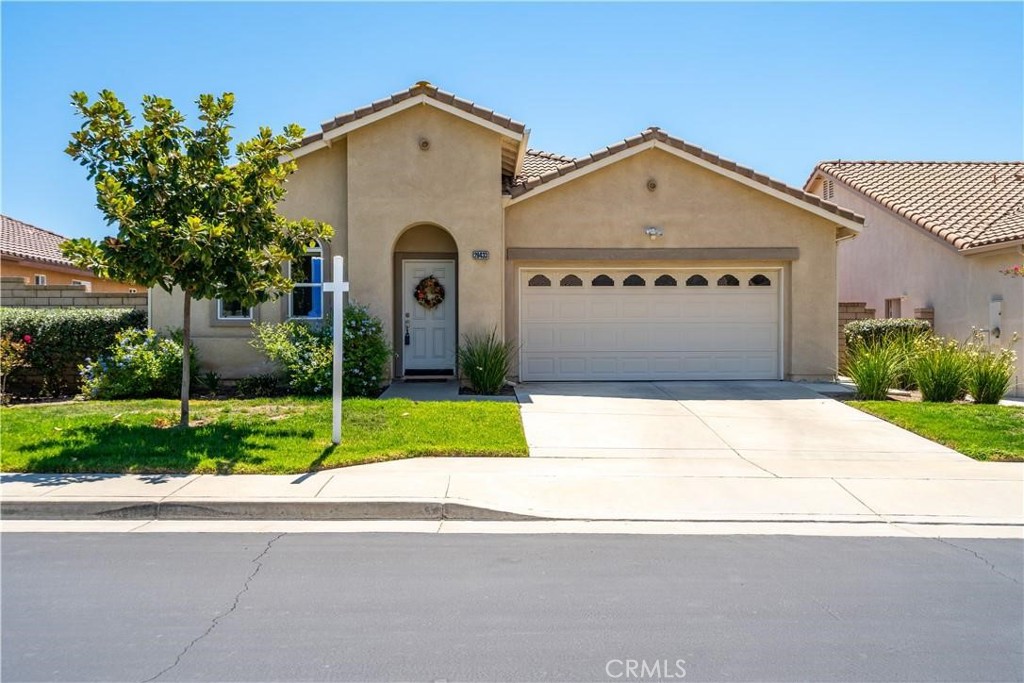 28433 Oasis View Circle Menifee, CA 92584 - Photo 26 of 26 a front view of house with garage and garden