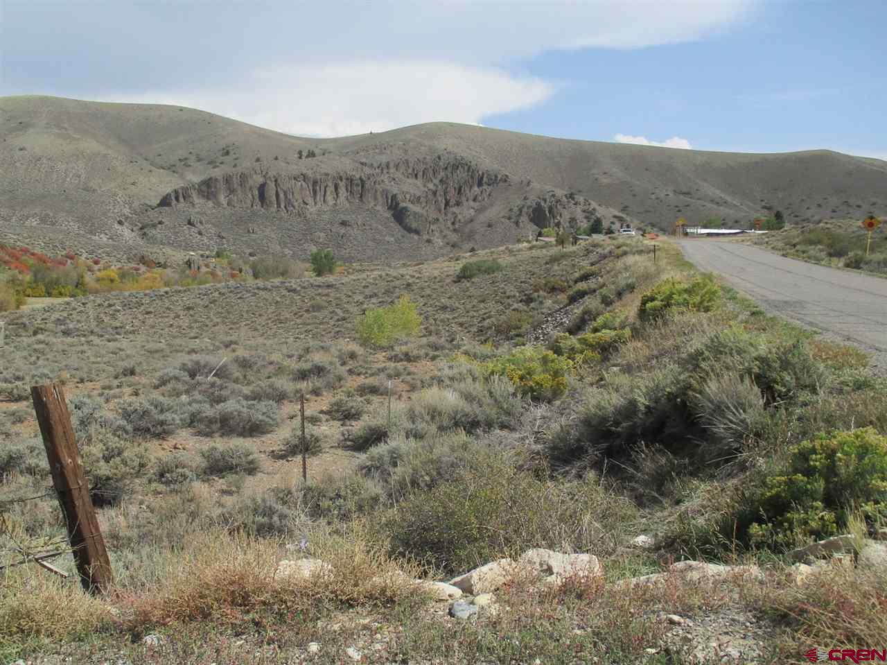 428 Antelope Road Gunnison, CO 81230 - Photo 8 of 9 a view of a dry field with mountains in the background