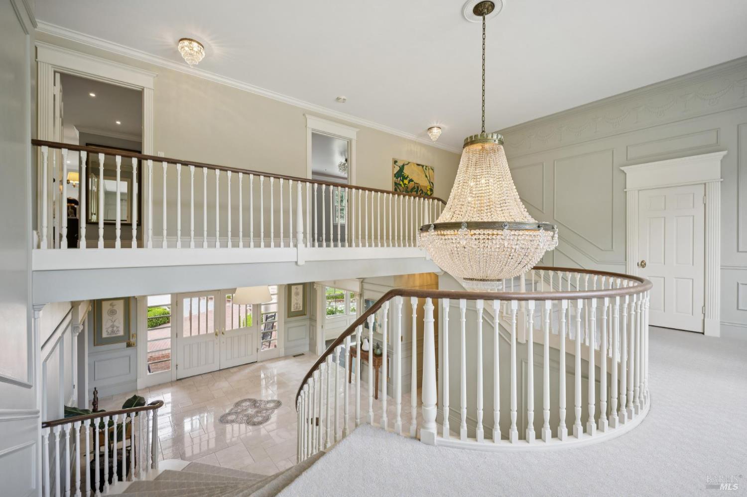 110 Mountain View Avenue San Rafael, CA 94901 - Photo 68 of 83 Grand foyer and crystal chandelier. Small set of stairs behind the door could accomodate an elevator from the first floor to the second floor.