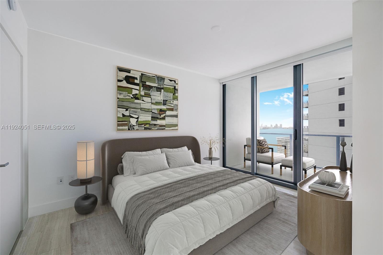 1451 Brickell Avenue, Unit 2003 Miami, FL 33131 - Photo 22 of 36 a bedroom with a bed a couch and large window