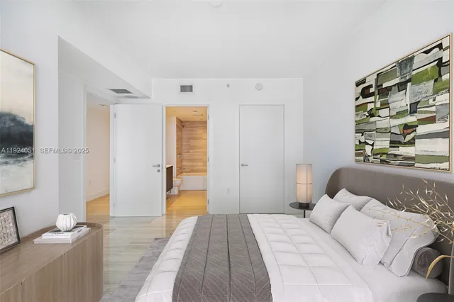 a bedroom with a bed and a couch