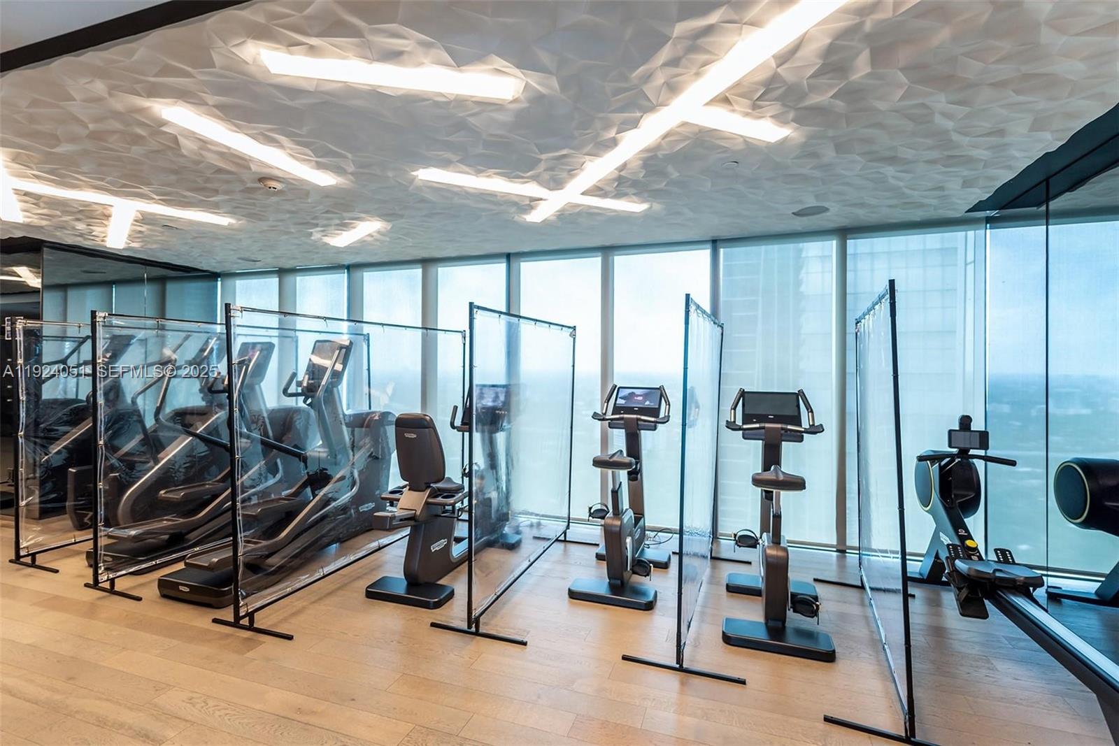 1451 Brickell Avenue, Unit 2003 Miami, FL 33131 - Photo 30 of 36 a view of a room with gym equipment