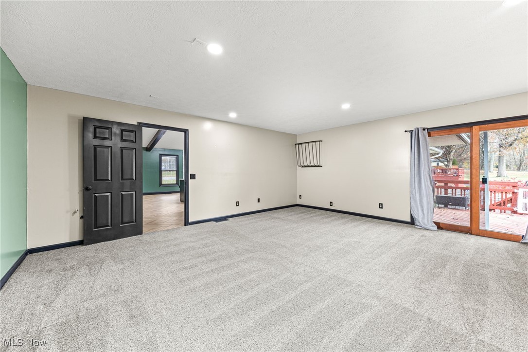 2840 Wadsworth Road Barberton, OH 44203 - Photo 10 of 32 Unfurnished room with light carpet and recessed lighting