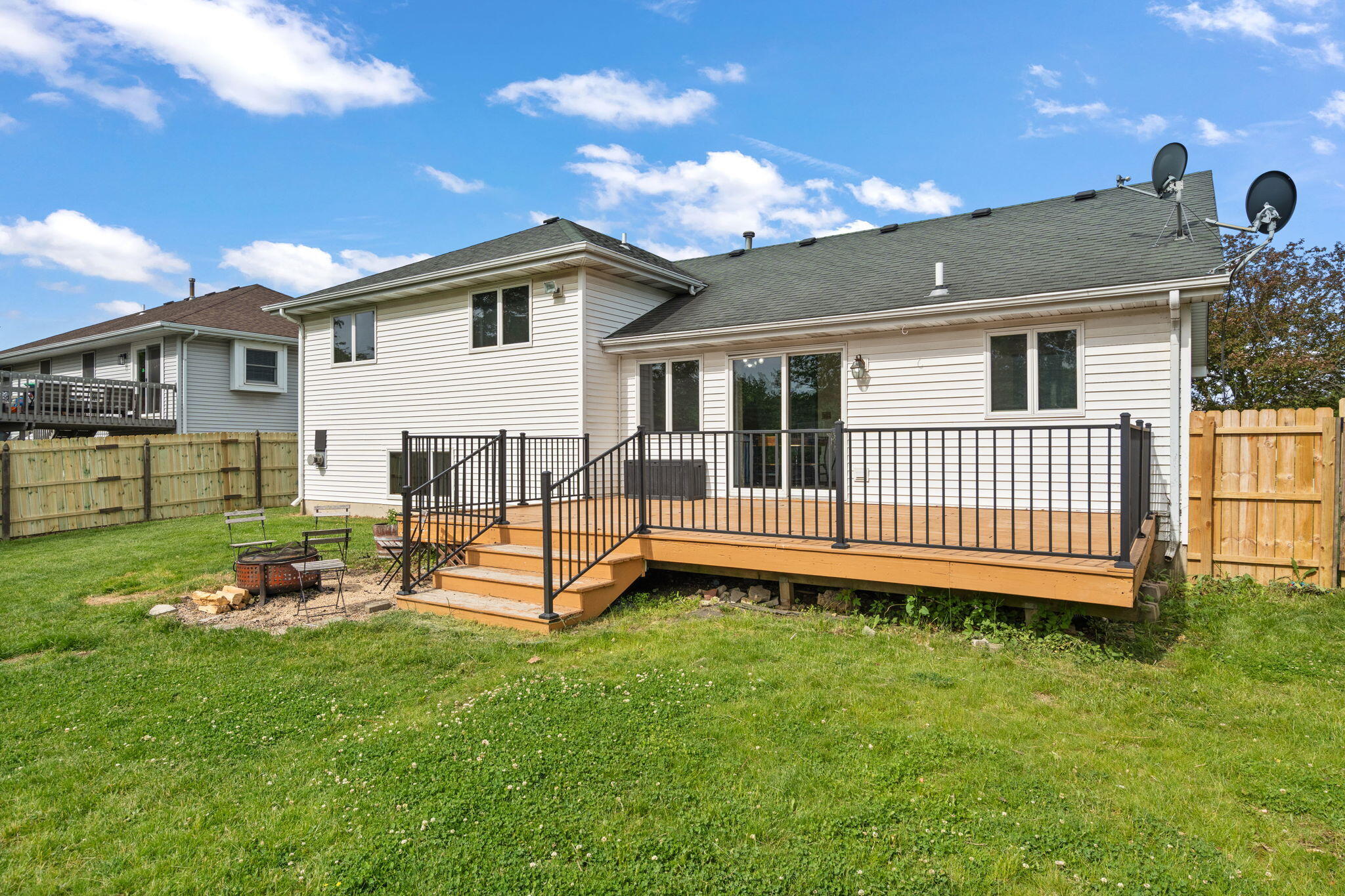 8987 Calhoun Place Crown Point, IN 46307 - Photo 26 of 28 a view of a house with a yard and deck