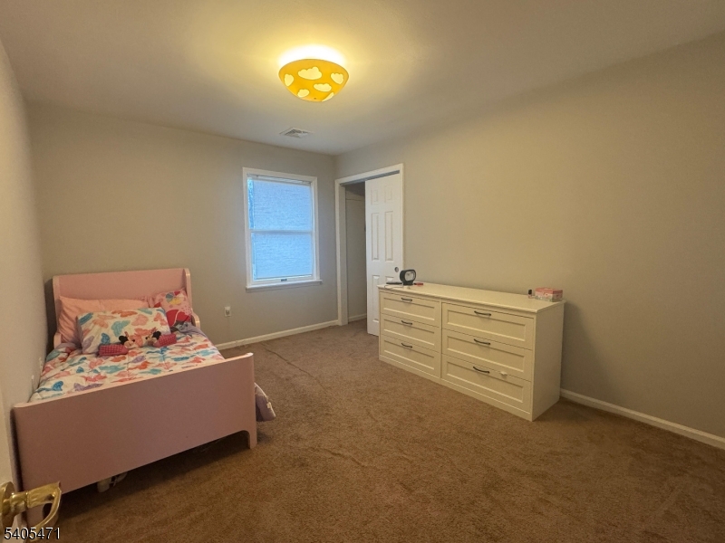 835 Dixie Lane Plainfield, NJ 07062 - Photo 20 of 37 a living room with furniture and a window