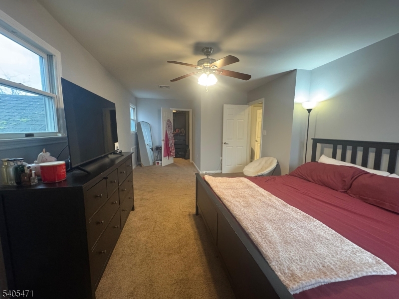 835 Dixie Lane Plainfield, NJ 07062 - Photo 23 of 37 a living room with stainless steel appliances kitchen island granite countertop furniture and a flat screen tv