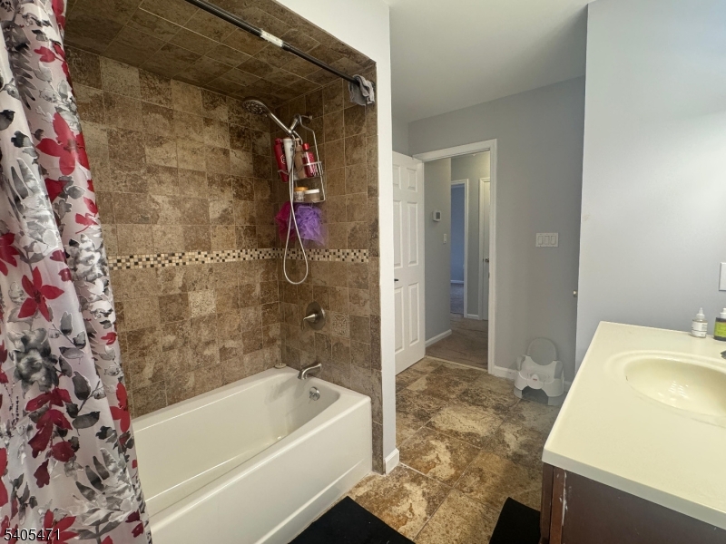 835 Dixie Lane Plainfield, NJ 07062 - Photo 25 of 37 a bathroom with a bathtub and a shower