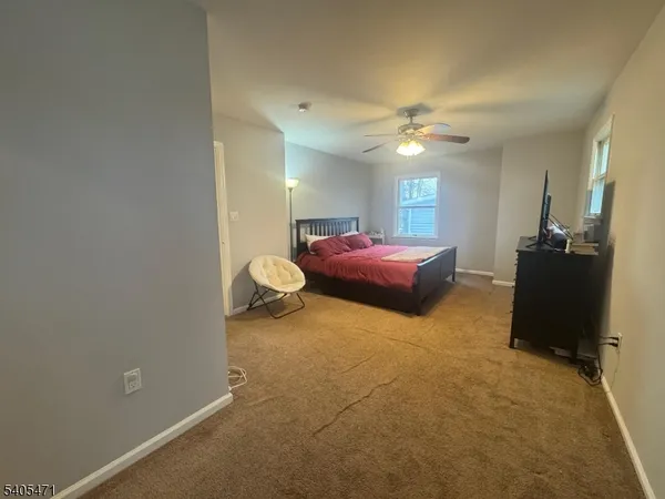 a view of a hallway with a room