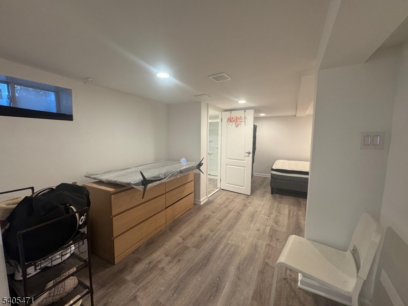 835 Dixie Lane Plainfield, NJ 07062 - Photo 28 of 37 a room with furniture and a wooden floor