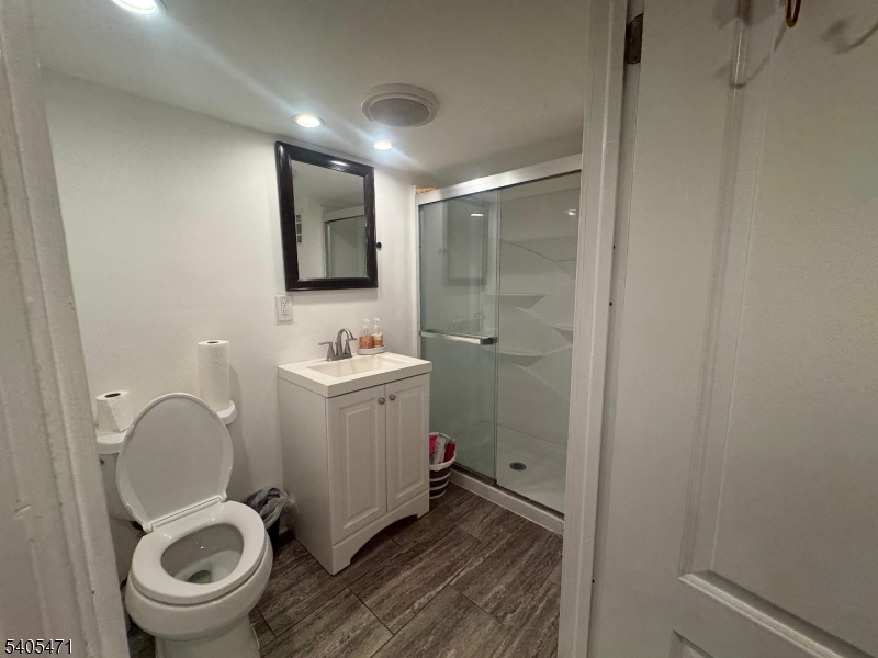 835 Dixie Lane Plainfield, NJ 07062 - Photo 29 of 37 a bathroom with a sink a toilet and a mirror