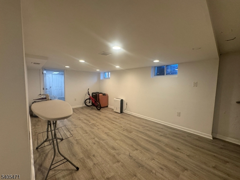 835 Dixie Lane Plainfield, NJ 07062 - Photo 32 of 37 a view of a room with wooden floor and a table
