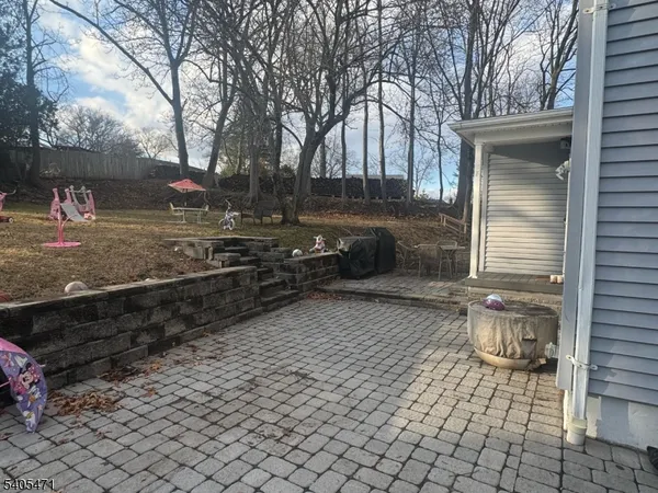 a view of a yard with a tree