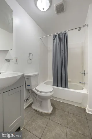 a bathroom with a toilet sink and a bathtub
