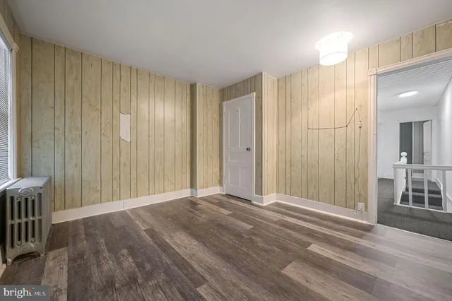 a view of a room with wooden walls