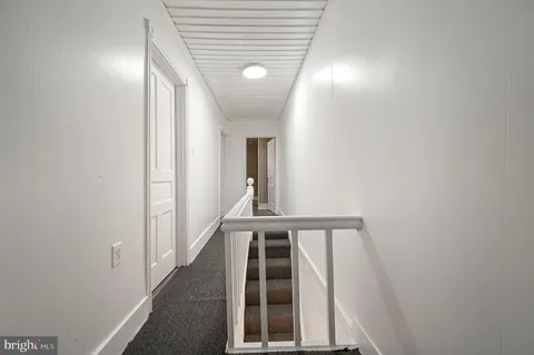 a view of staircase with large window