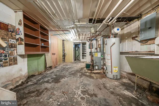 a view of empty room with wooden walls