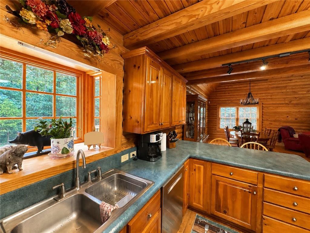 1120 Ridgewood Drive Pendergrass, GA 30567 - Photo 18 of 29 a kitchen with large windows and sink