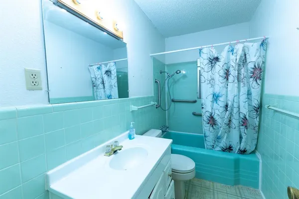 a bathroom with a sink and toilet