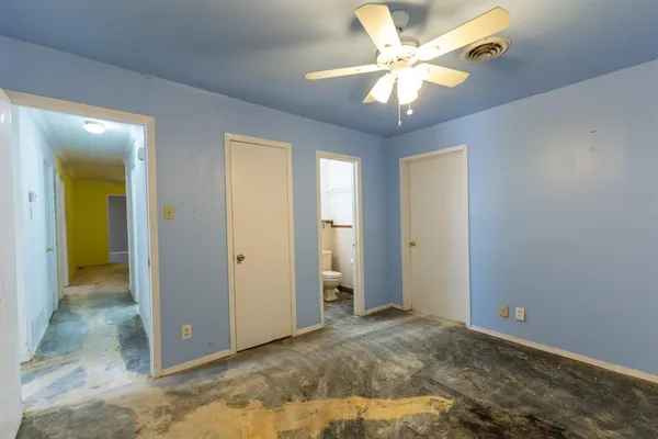 a view of a livingroom with a chandelier fan