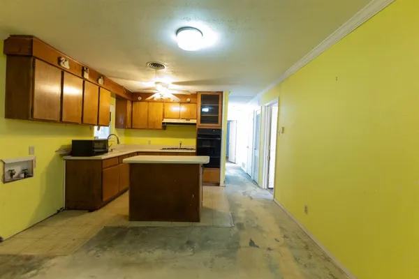 a kitchen with a sink and cabinets