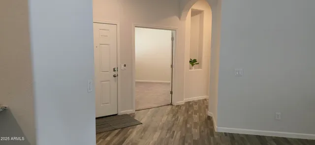 a view of a room with wooden floor and closet