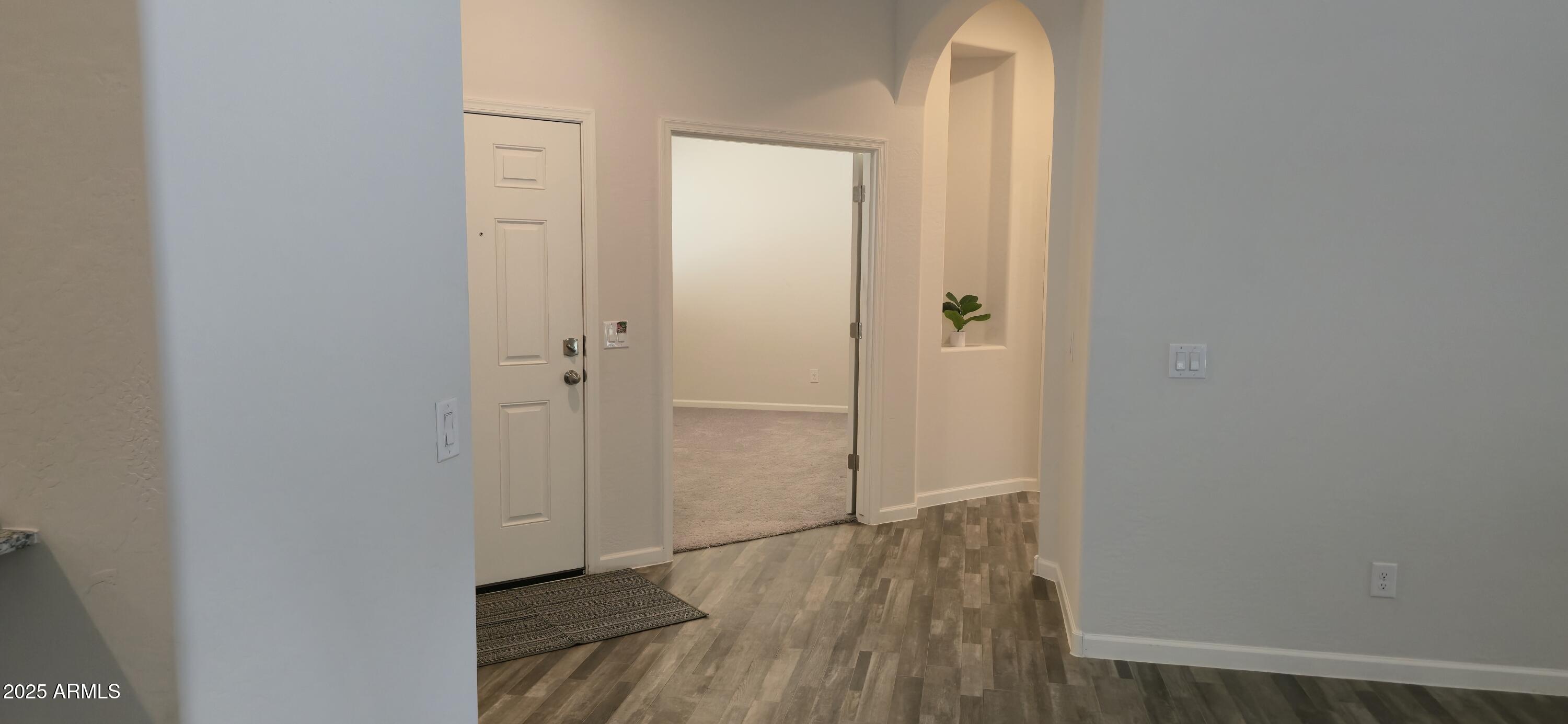 701 Dylan Court Wickenburg, AZ 85390 - Photo 12 of 29 a view of a room with wooden floor and closet