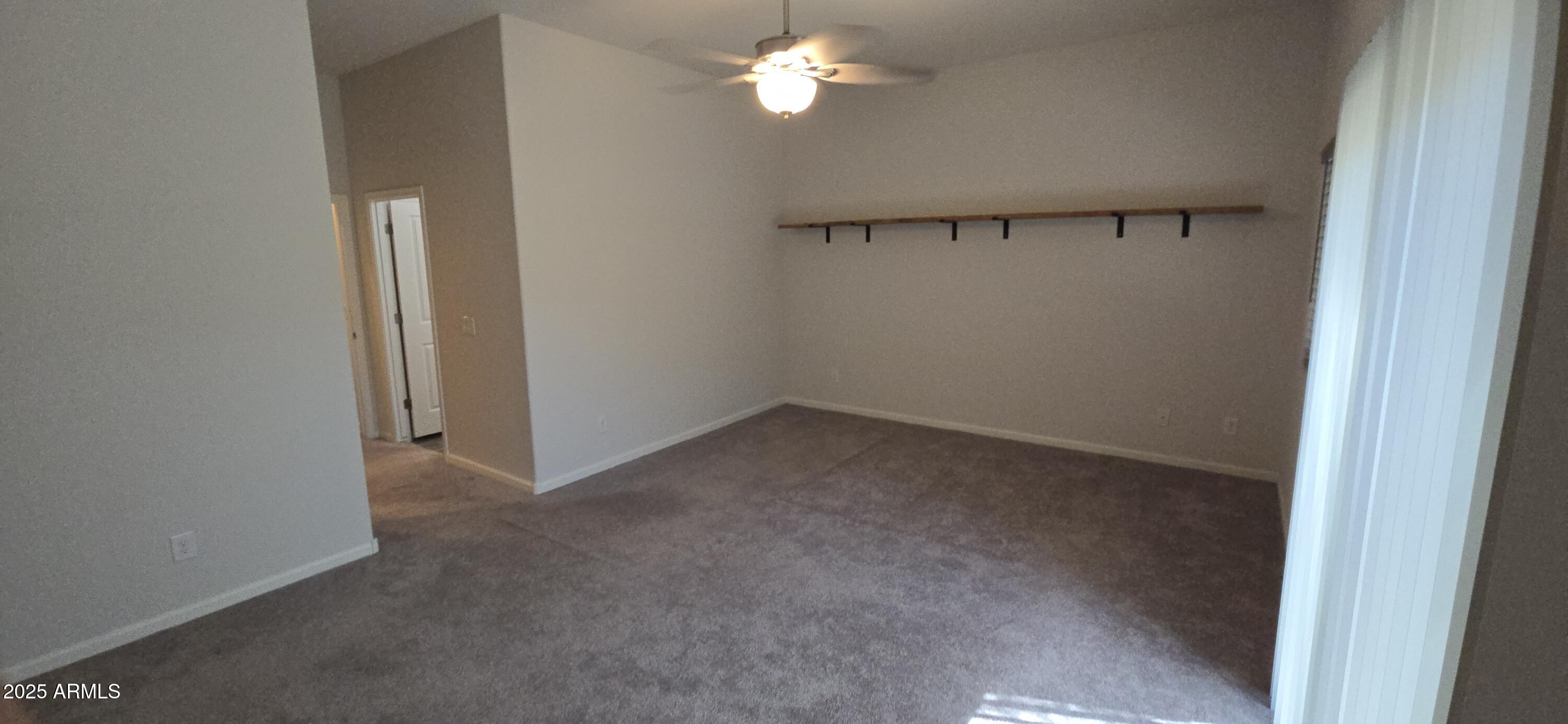 701 Dylan Court Wickenburg, AZ 85390 - Photo 14 of 29 a view of empty room with window