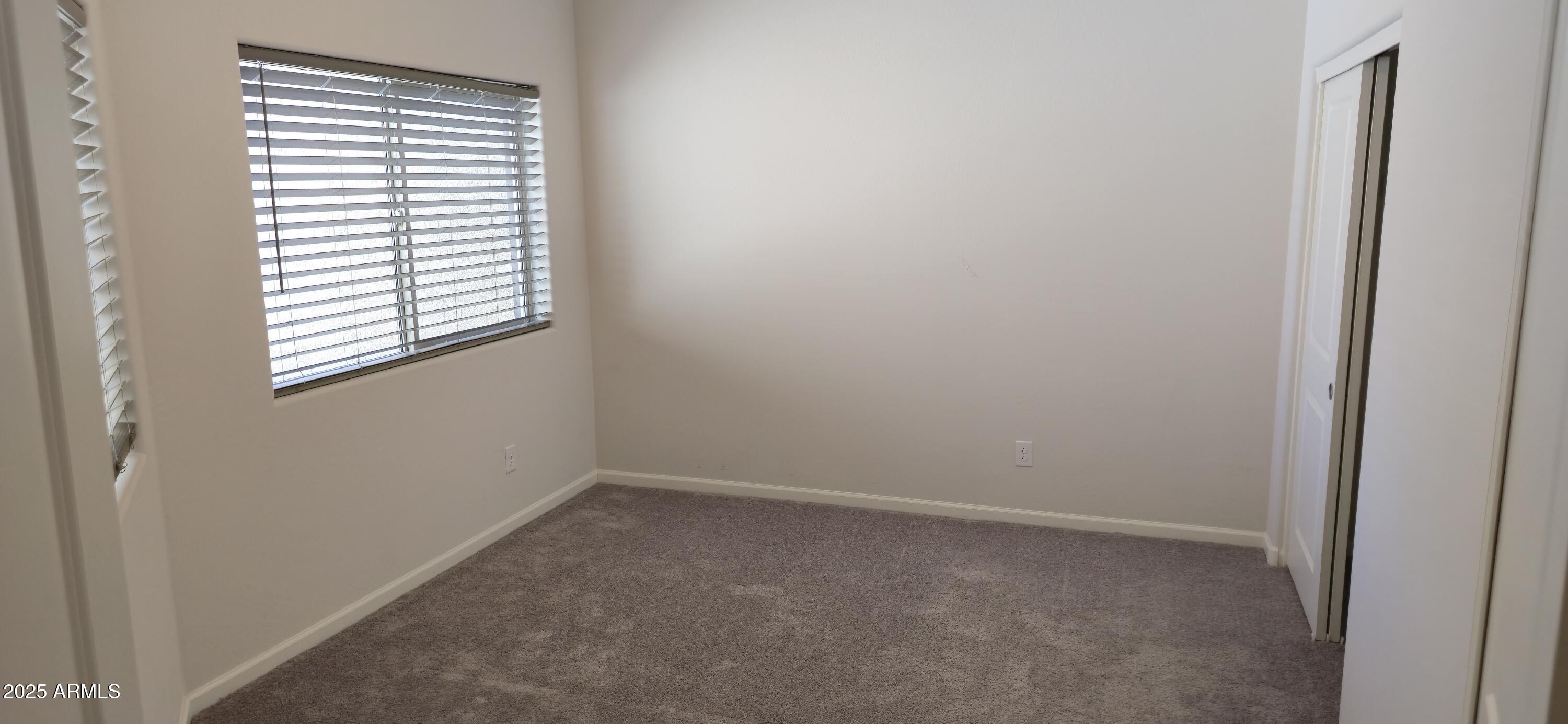 701 Dylan Court Wickenburg, AZ 85390 - Photo 22 of 29 an empty room with a window