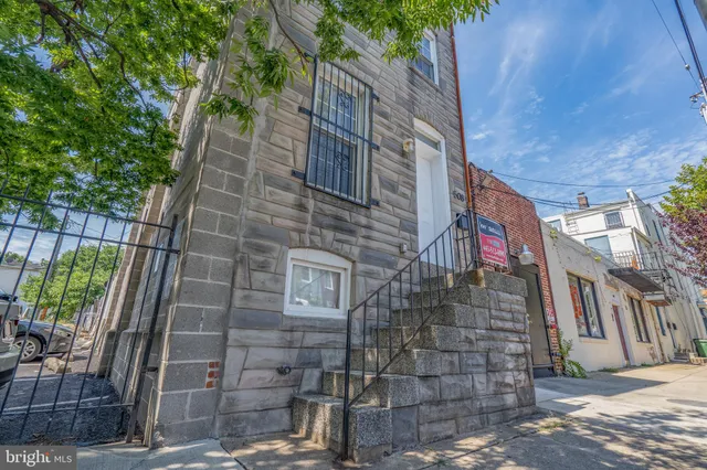 a brick building with a street