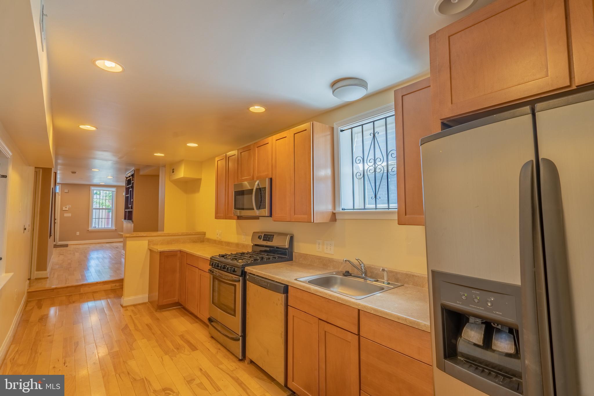 508 Scott Street Baltimore, MD 21230 - Photo 12 of 63 a kitchen with stainless steel appliances granite countertop a sink stove and refrigerator