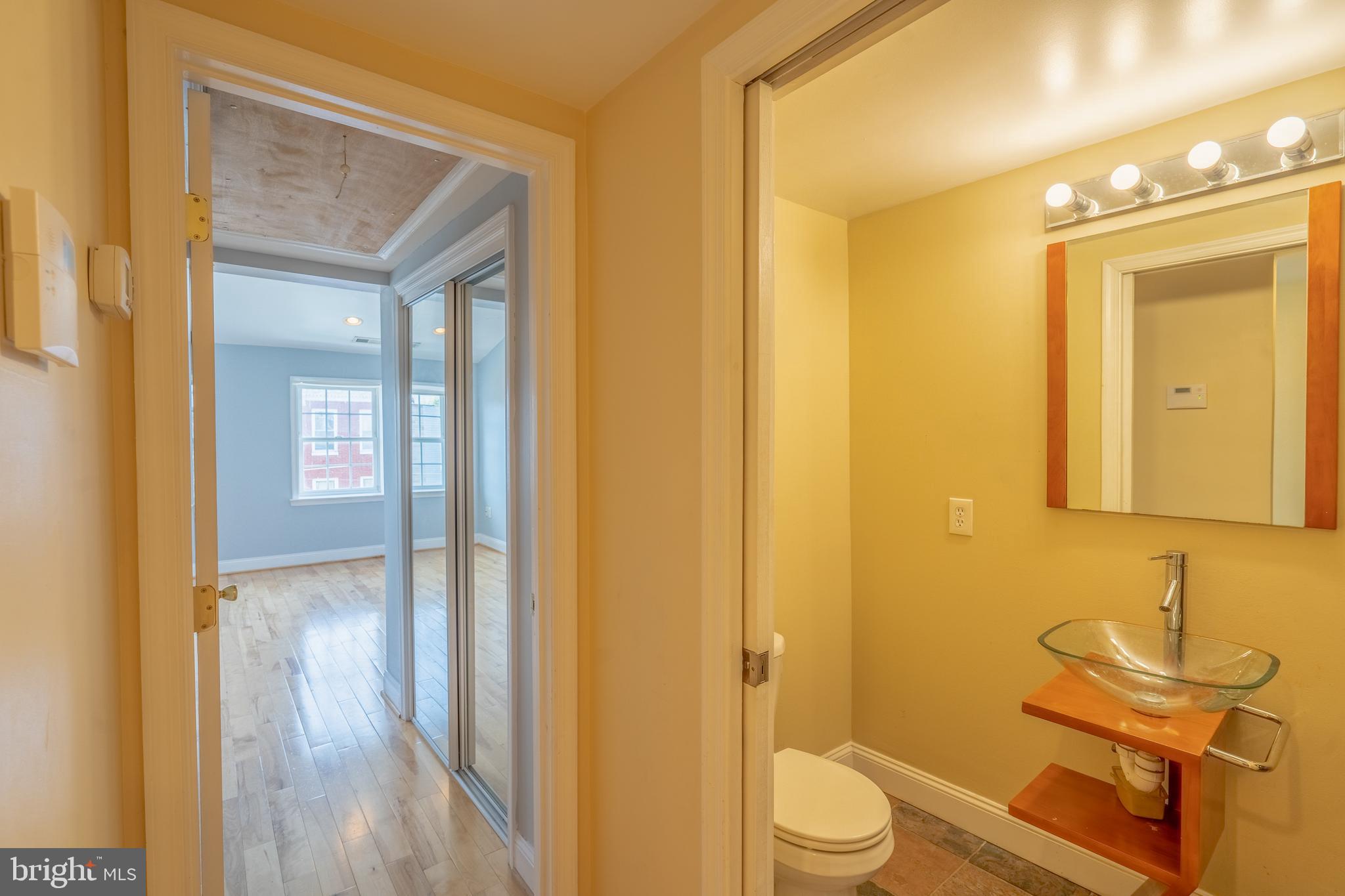508 Scott Street Baltimore, MD 21230 - Photo 20 of 63 a bathroom with a sink a toilet and shower