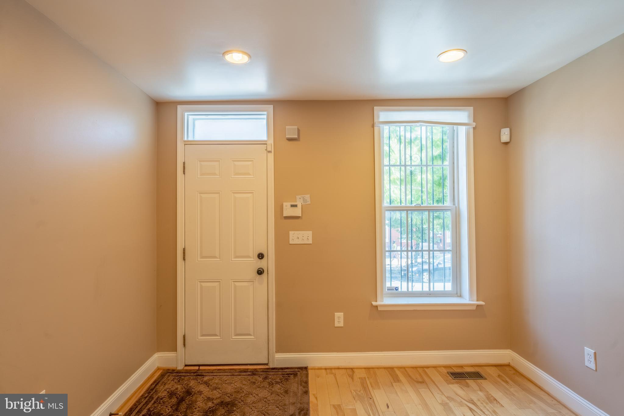 508 Scott Street Baltimore, MD 21230 - Photo 3 of 63 an empty room with wooden floor and windows