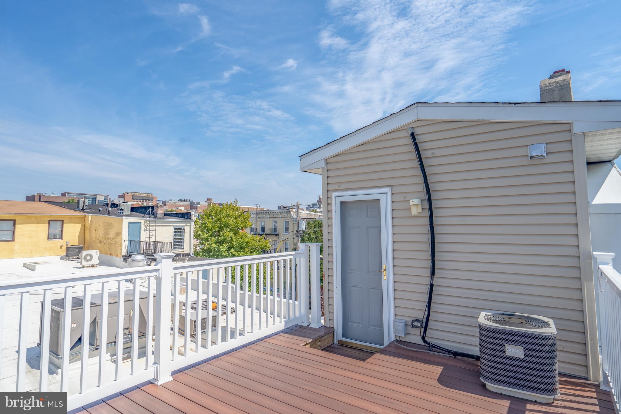508 Scott Street Baltimore, MD 21230 - Photo 31 of 63 a view of a balcony with wooden floor and fence